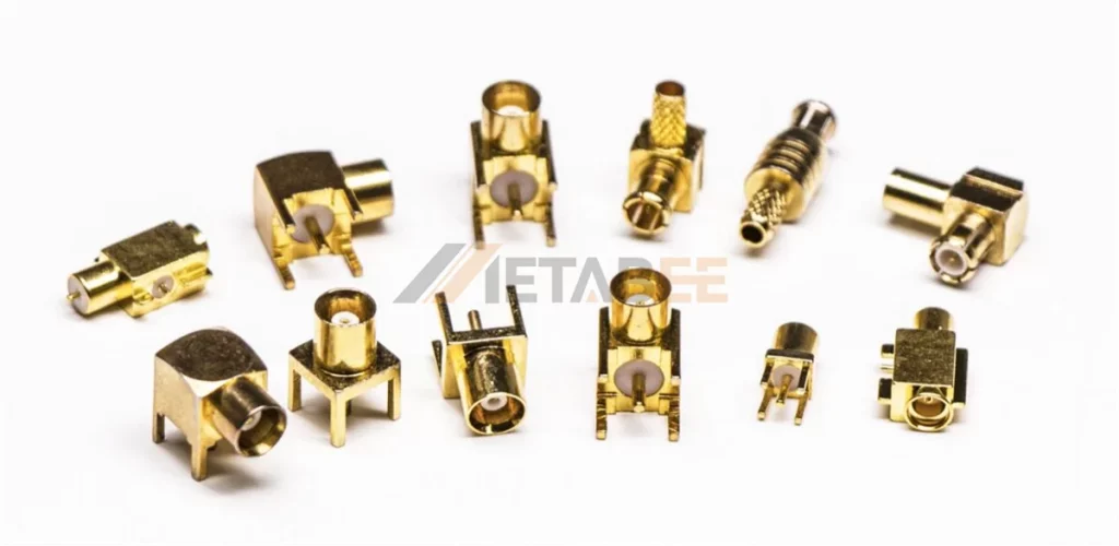 A group of various gold-plated MCX and MMCX snap-on connectors in straight and right-angle designs.