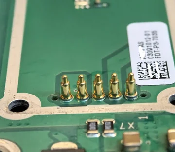 SMT pogo pins mounted on a PCB for surface mount assembly applications